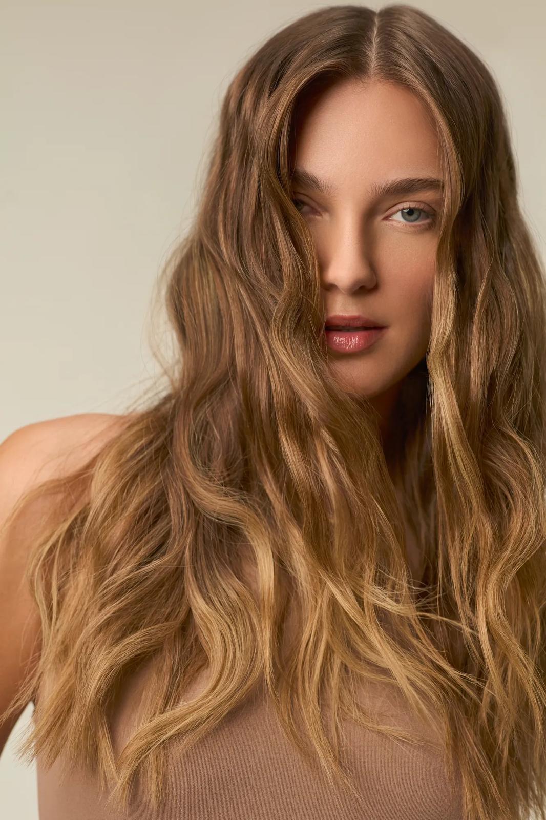 image of a woman with wavy blonde hair