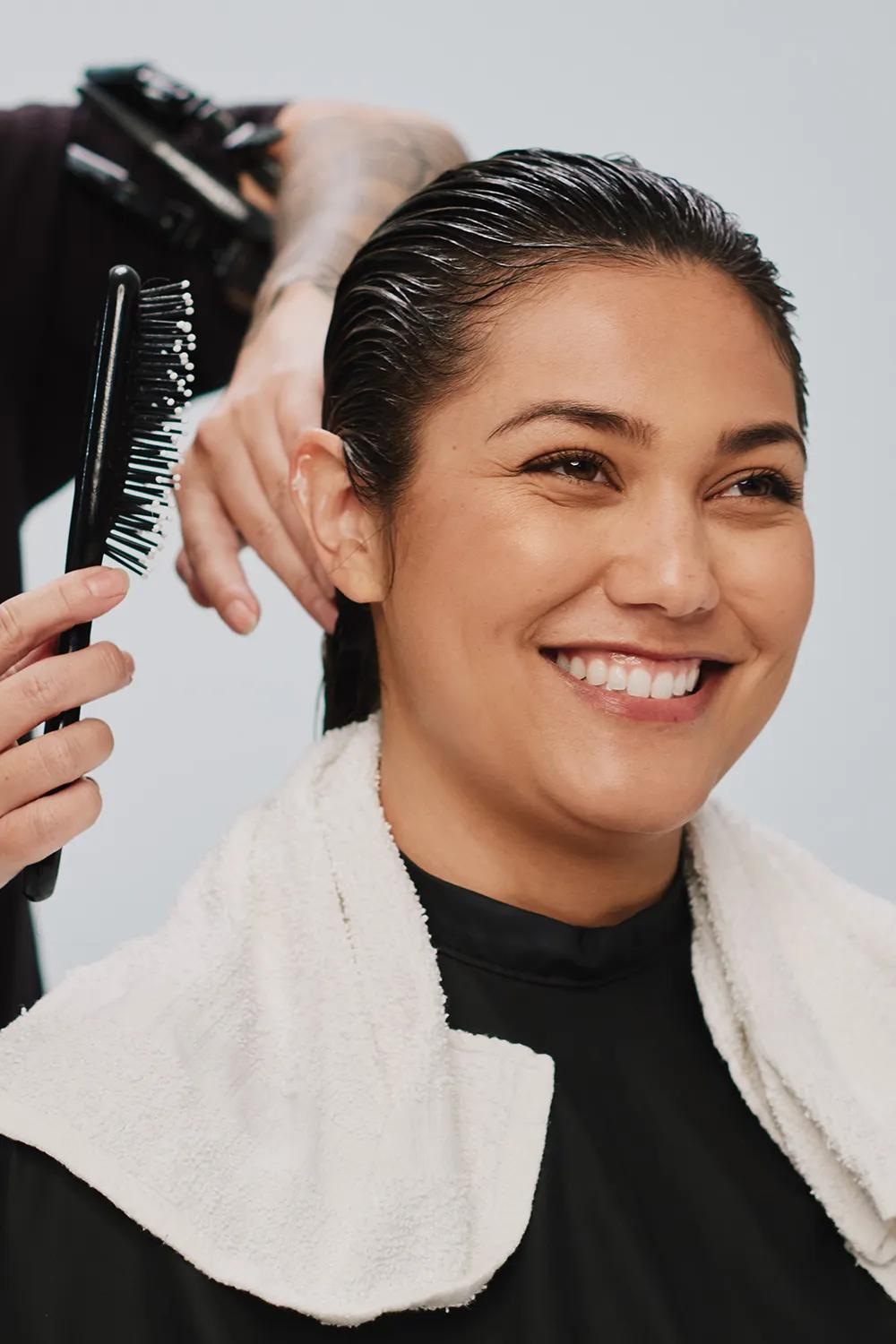 image of a model holding bottles of The Demi