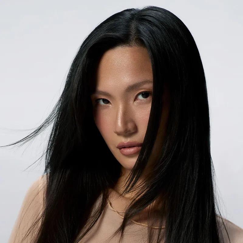 artistic image of model with black, sleek hair