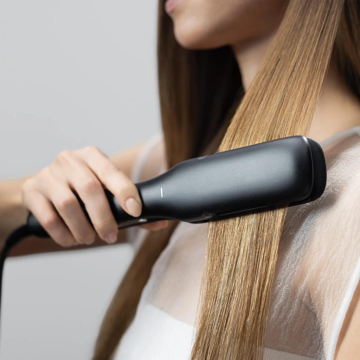 image of a woman using the Neuro Smooth+ 1.75-inch Flat iron
