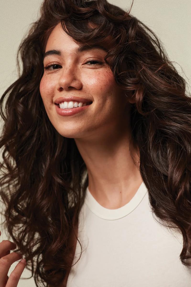 image of a woman with wavy brunette hair