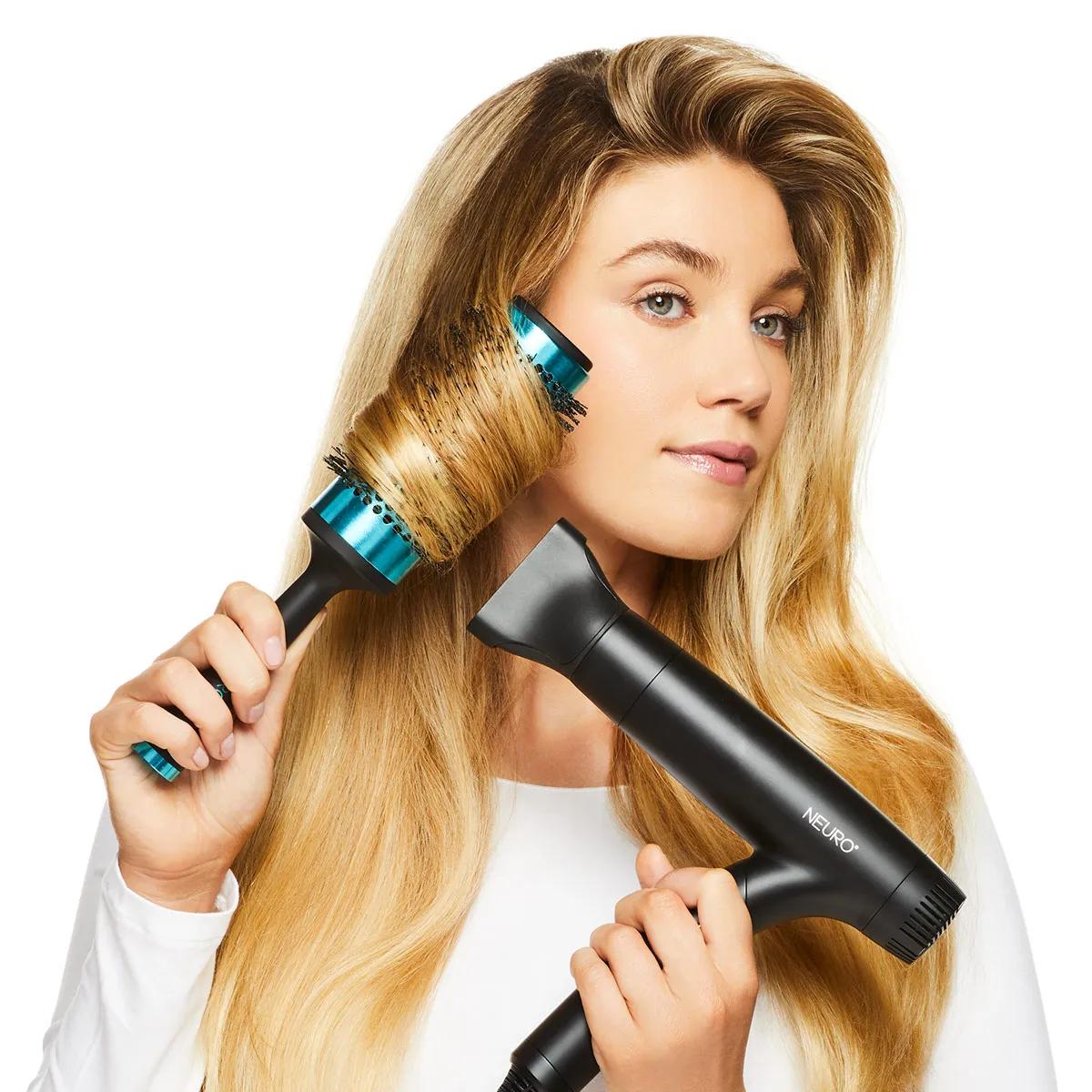 image of a blonde woman blow-drying her hair