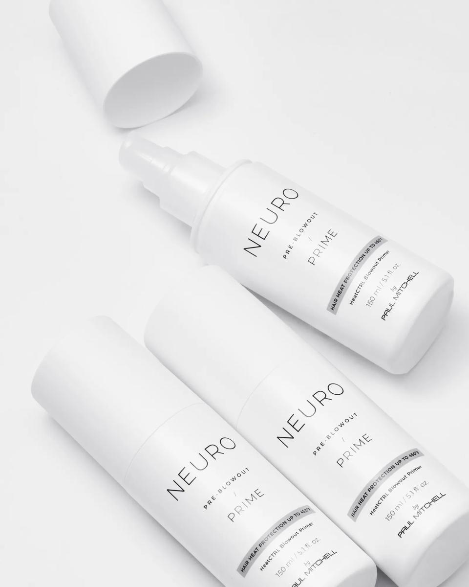 flatlay image of multiple Neuro Prime HeatCTRL Blowout Primer bottles