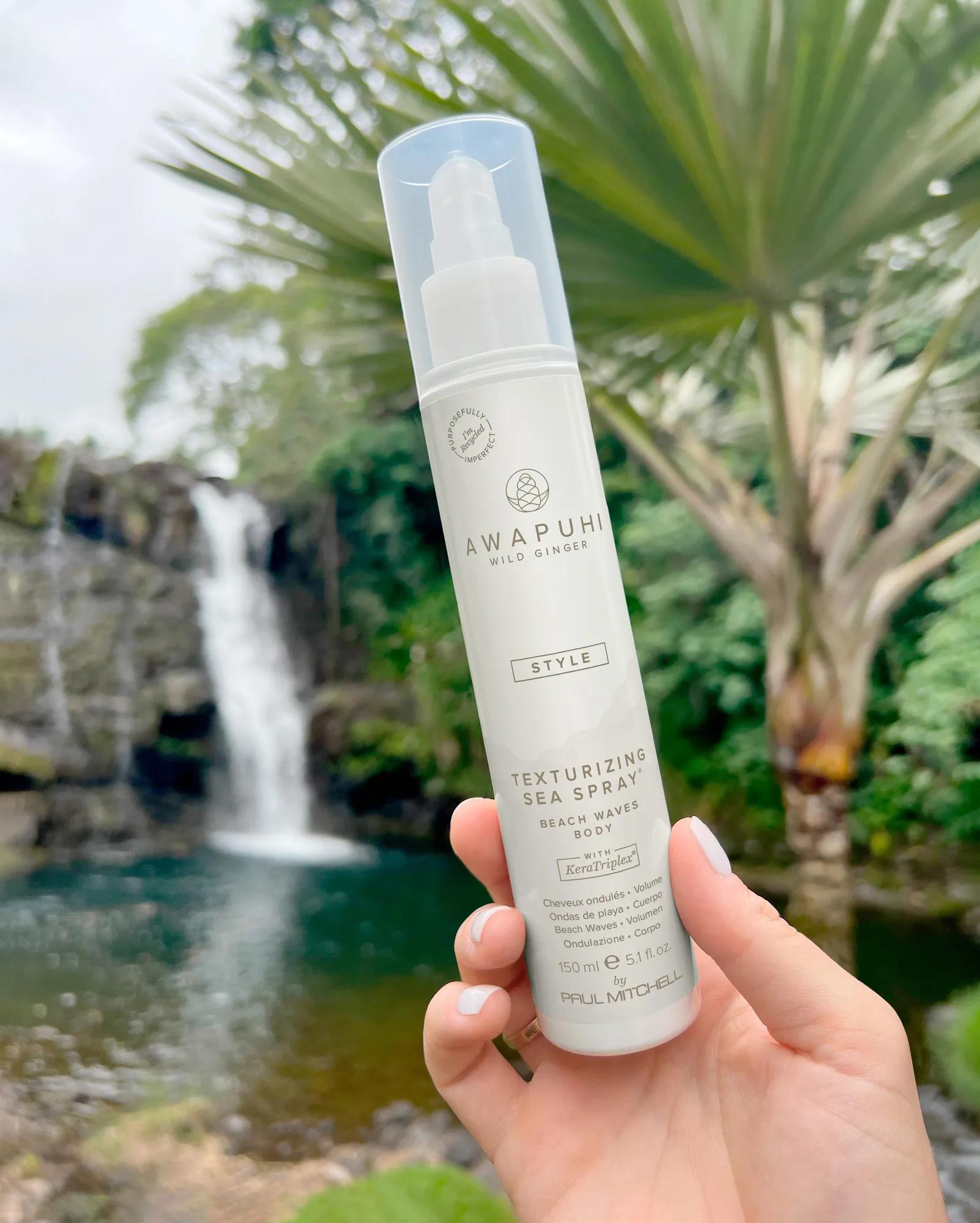 image of a model holding a tube of Texturizing Sea Spray